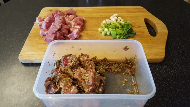 seasoned diced pork and sliced onions